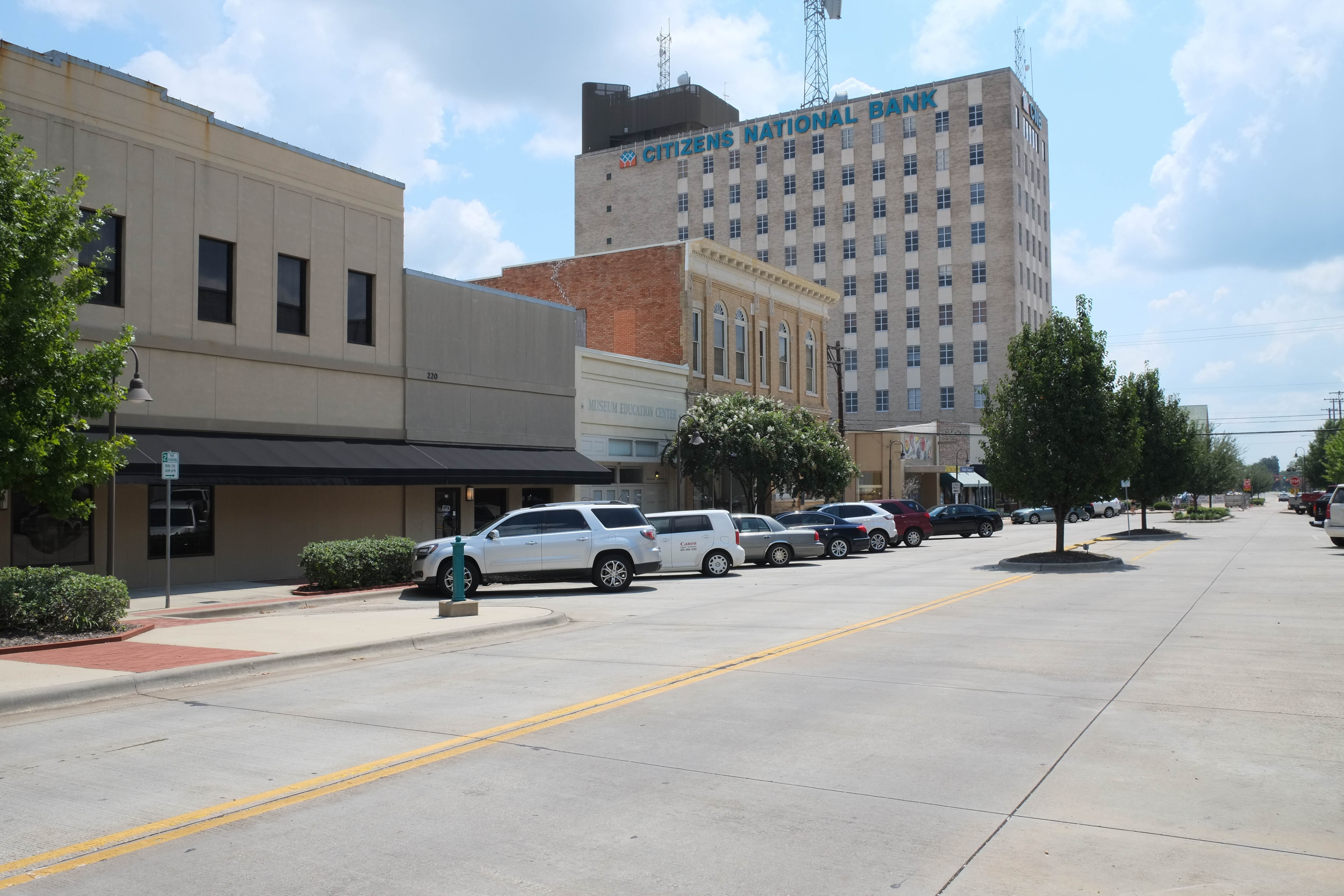 Downtown Longview, Texas, with historic storefronts and the Citizens National Bank building